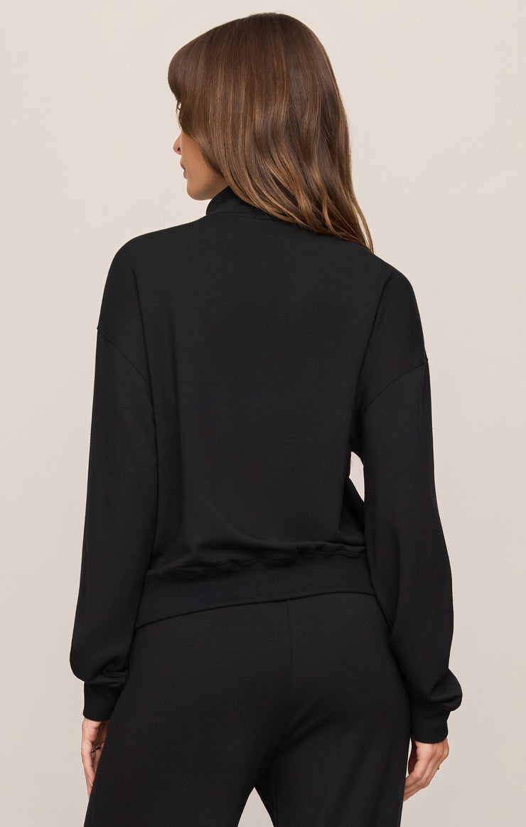 Black half-zip sweatshirt, back view with ribbed cuffs and hem, relaxed fit