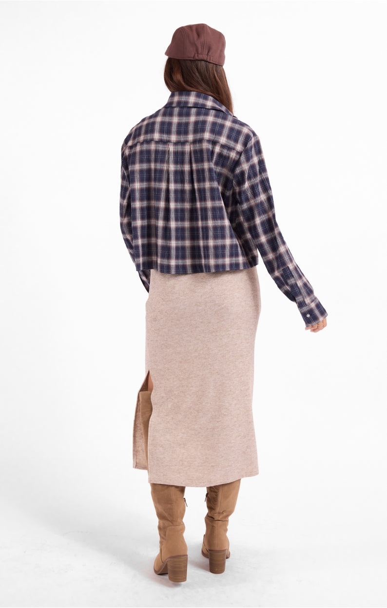 Navy and tan plaid button-up shirt, back view, long sleeves with curved hem