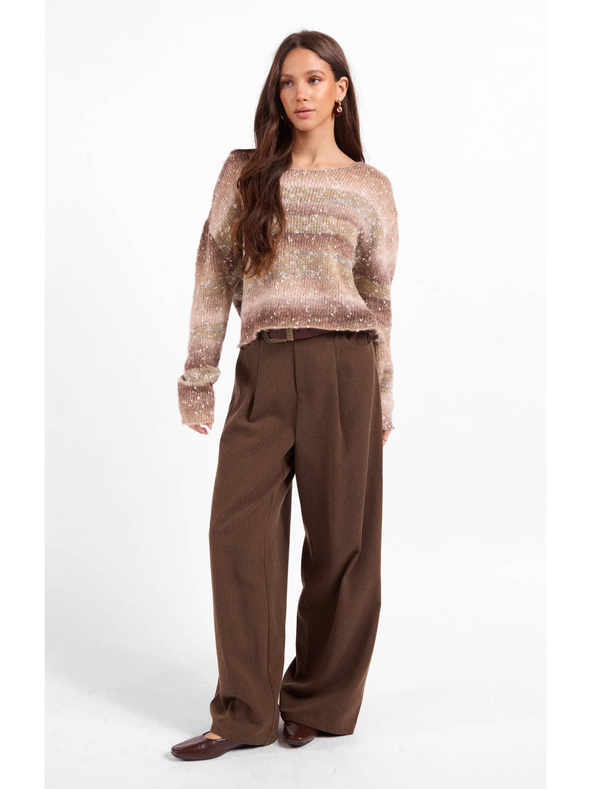Ombre sparkle knit sweater with long sleeves and relaxed fit over dark trousers