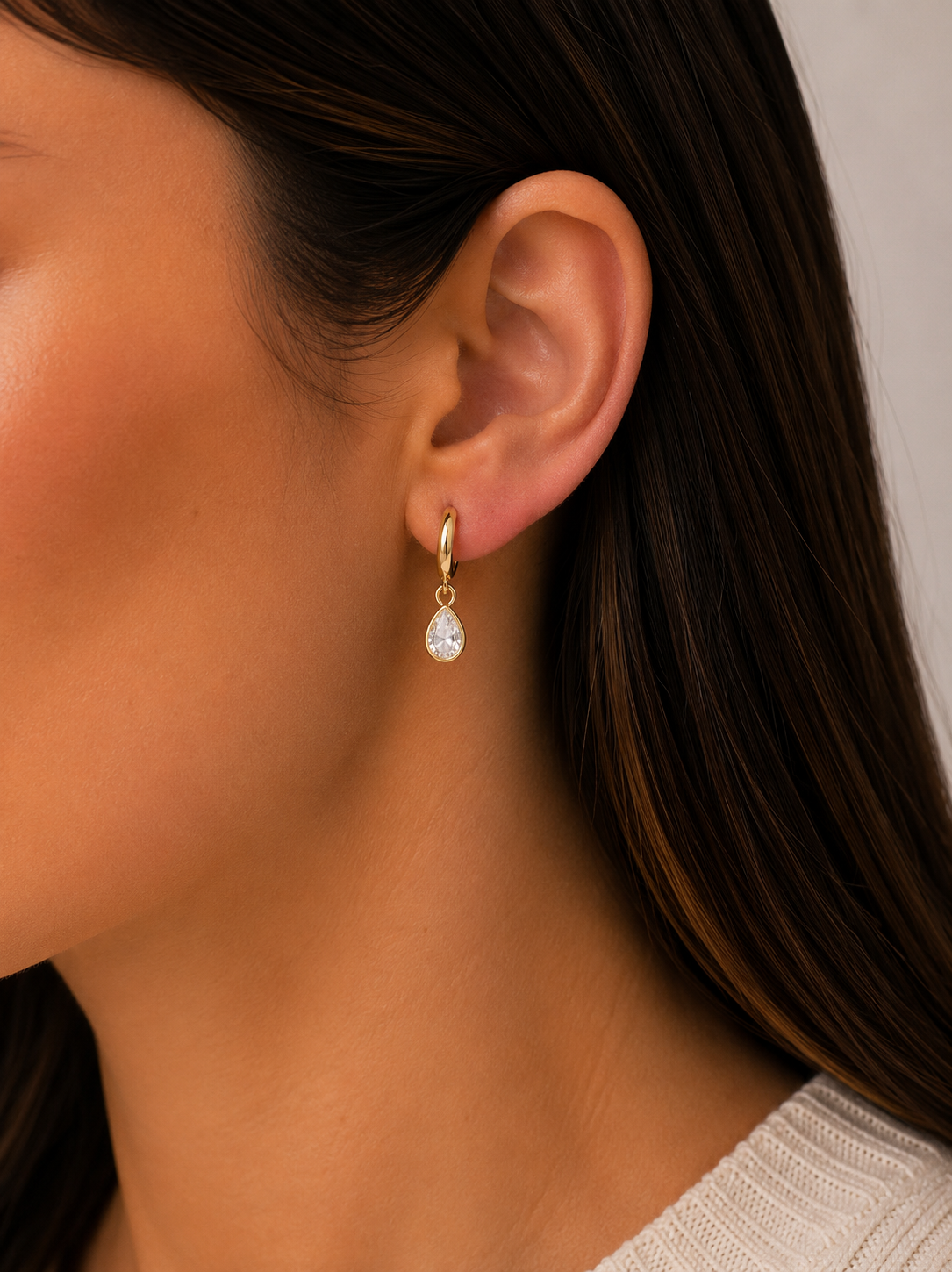 Gold teardrop CZ charm hoop earrings with dangling clear white stones