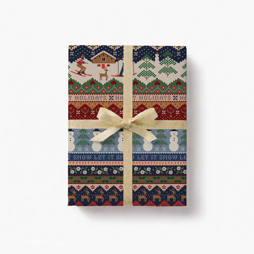 Holiday ski chalet wrapping paper with navy, red, and green festive pattern