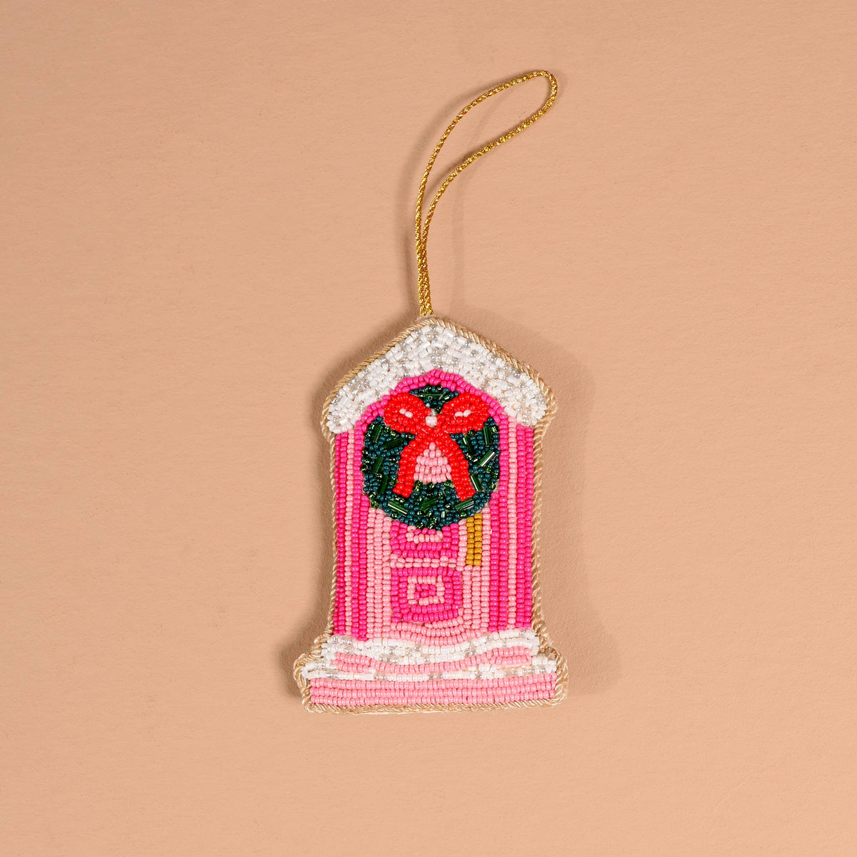 Handcrafted beaded hanging ornament with red wreath center, pink striped body, cream trim, gold cord