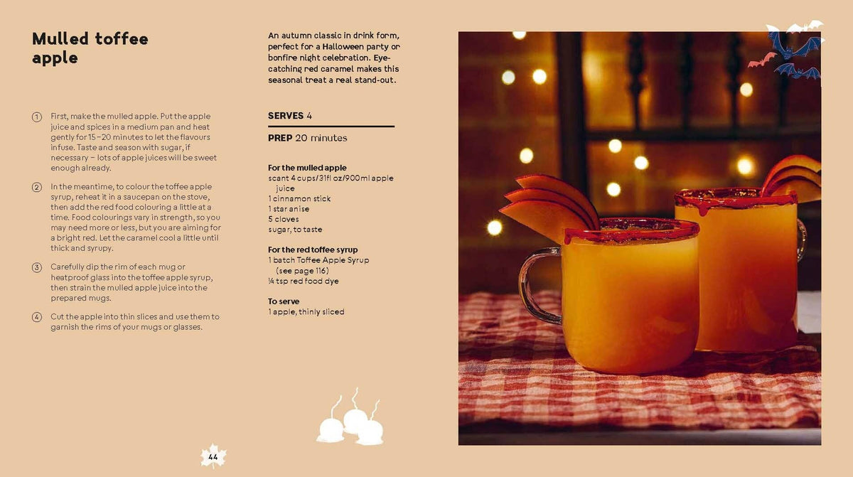 Yellow spiced drink in a mug with holiday lights background