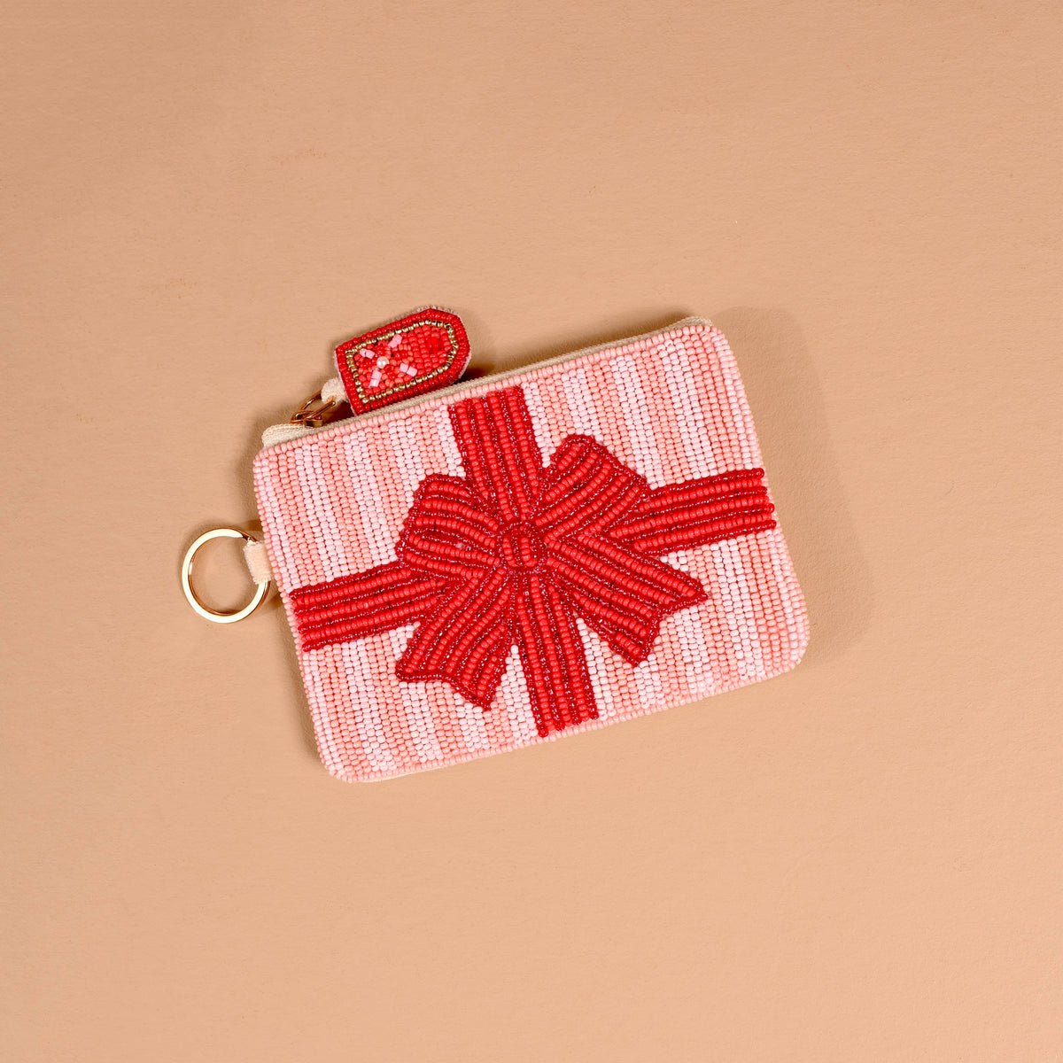 Red beaded pouch with bow applique and metal keyring loop