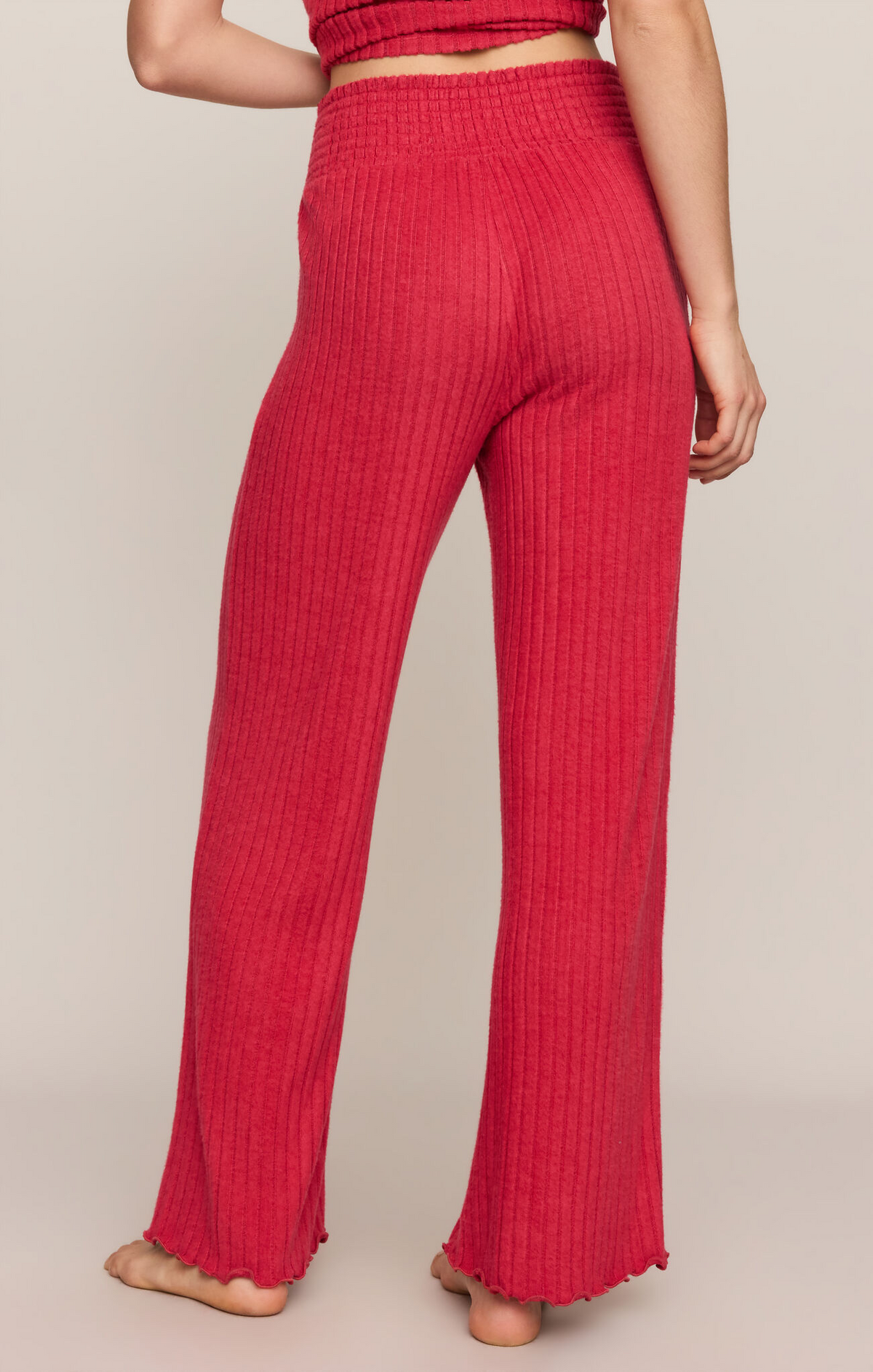 Ruby red ribbed flare pants with smocked elastic waistband and wide straight legs