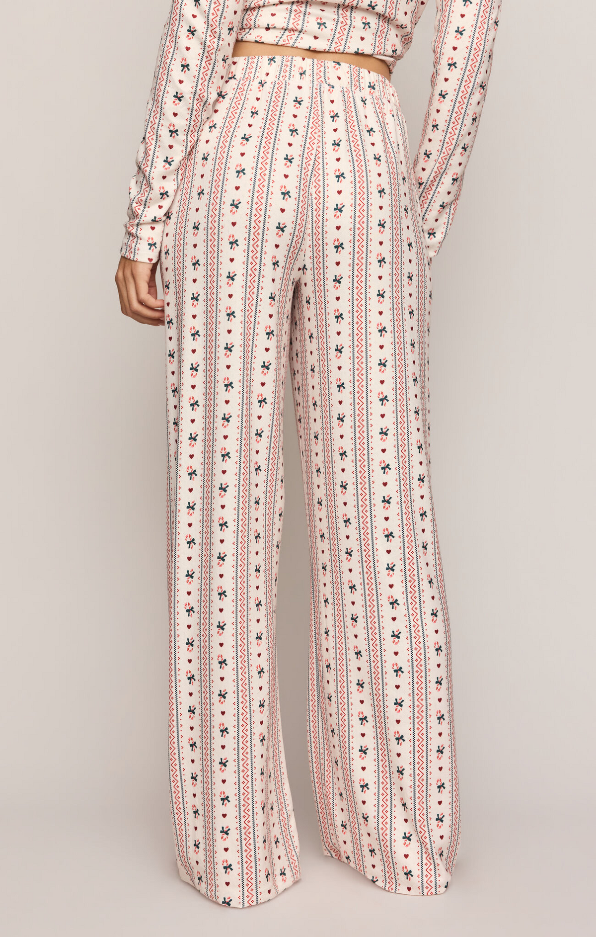 Candy cane print pajama pants, off-white vertical stripe pattern, wide-leg, elastic waist