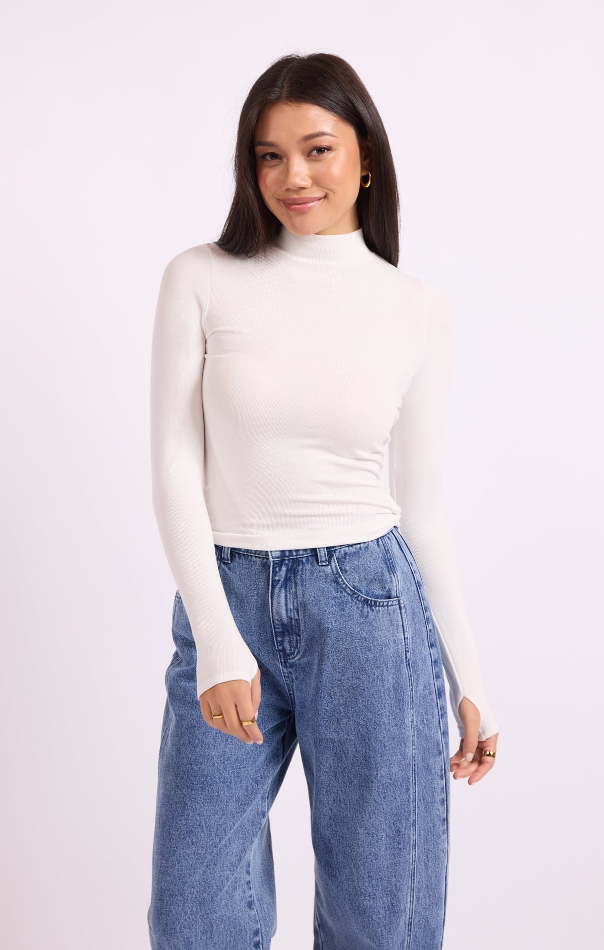 White knit turtleneck top with long sleeves, fitted silhouette