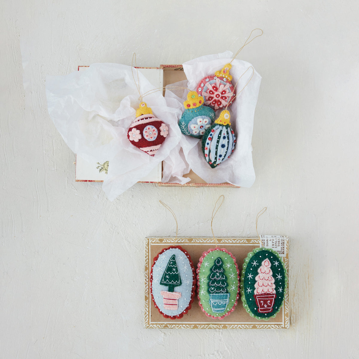 Felt embroidery finial ornaments in a paper-lined gift box with hanging loops