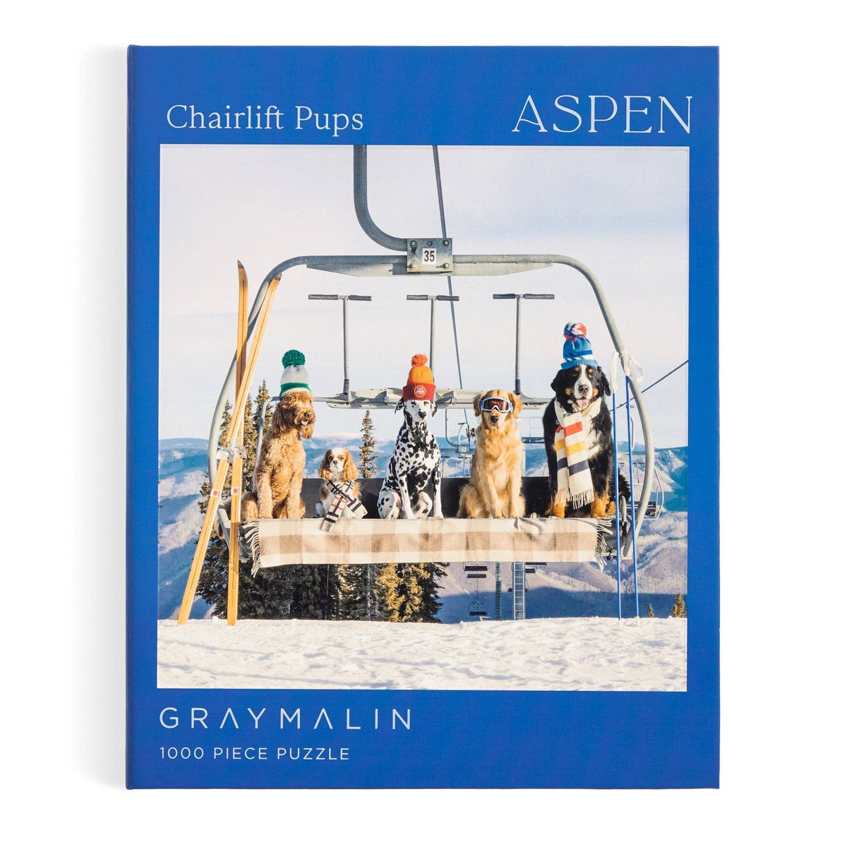 Blue 1000-piece jigsaw puzzle box front with dogs on a ski chairlift