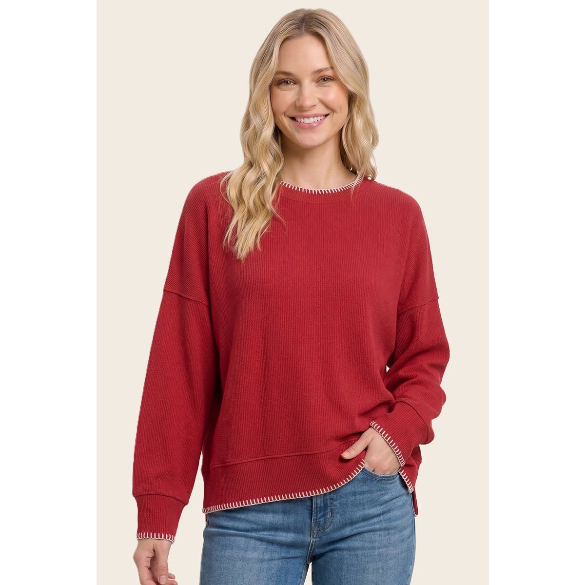 Women’s red stitched crewneck sweater with drop-shoulder sleeves and ribbed cuffs