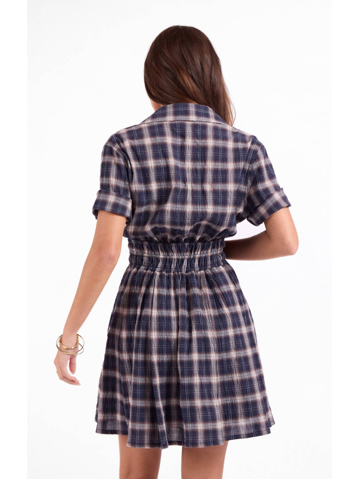 Back view of navy plaid shirt dress with short sleeves and gathered waist