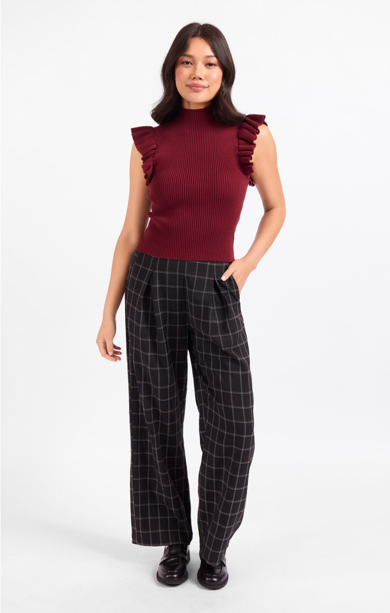 Burgundy sleeveless mockneck tank sweater with ruffled shoulder accents
