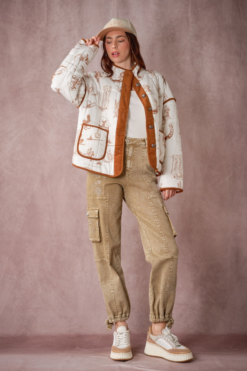 Western quilted jacket full view, white cowboy print, brown cord front with snap buttons, pockets