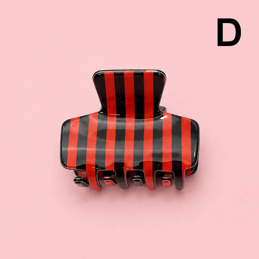 Red and black striped hair claw clip with five prongs