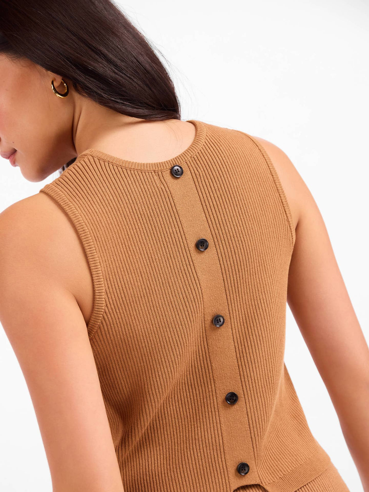 Sleeveless knit sweater with back button placket, camel-brown ribbed knit.