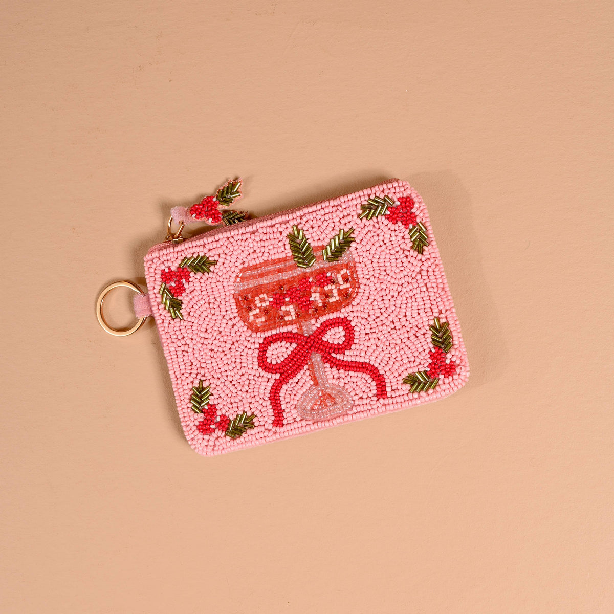 Cranberry pink beaded pouch with bow motif and gold ring clasp