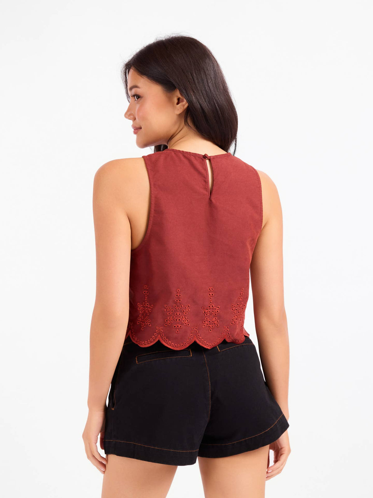 Sleeveless rust top, back view with keyhole neck and scalloped eyelet hem