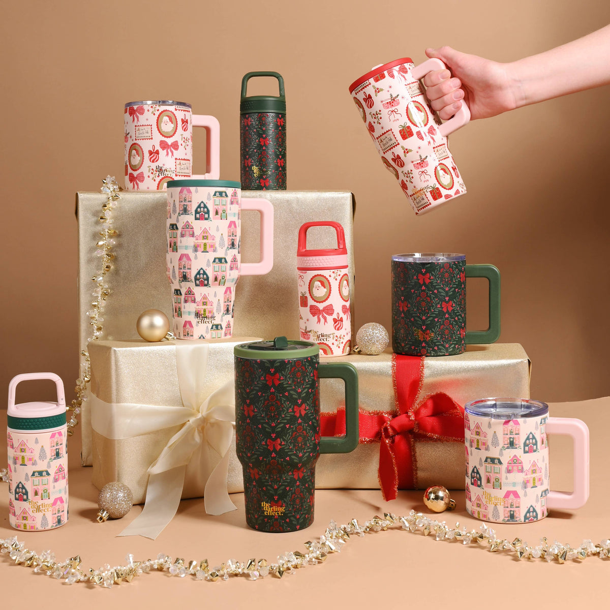 Insulated 14 oz mug held in hand, red-and-cream town pattern, green handle
