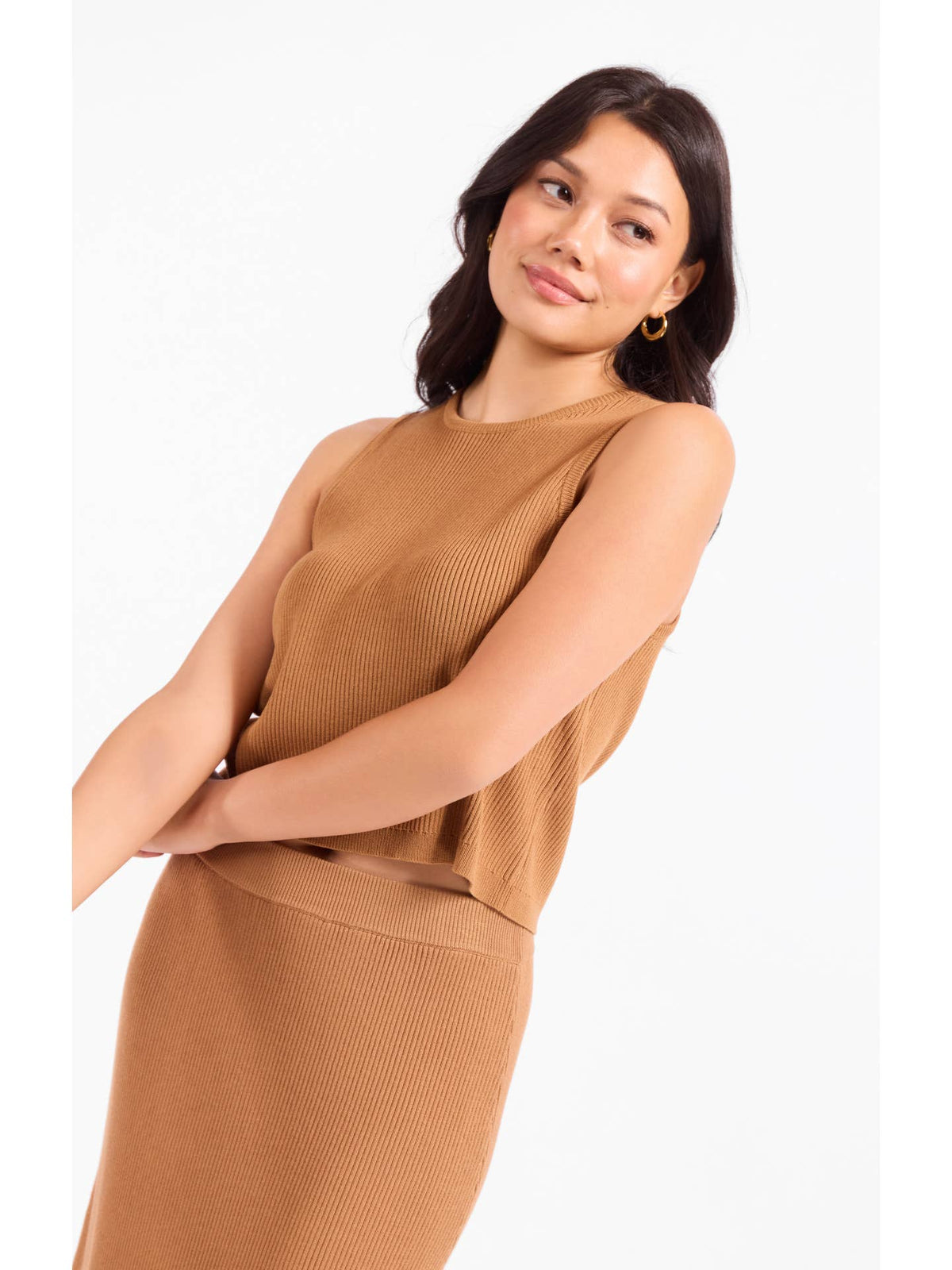Sleeveless knit sweater with buttoned back detail, camel-brown ribbed knit.
