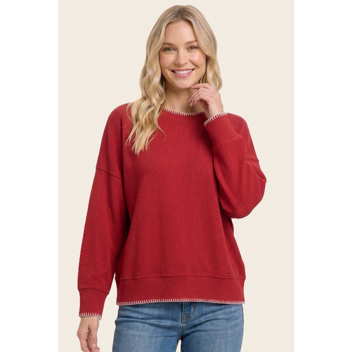 Women’s red stitched crewneck sweater with ribbed cuffs and hem