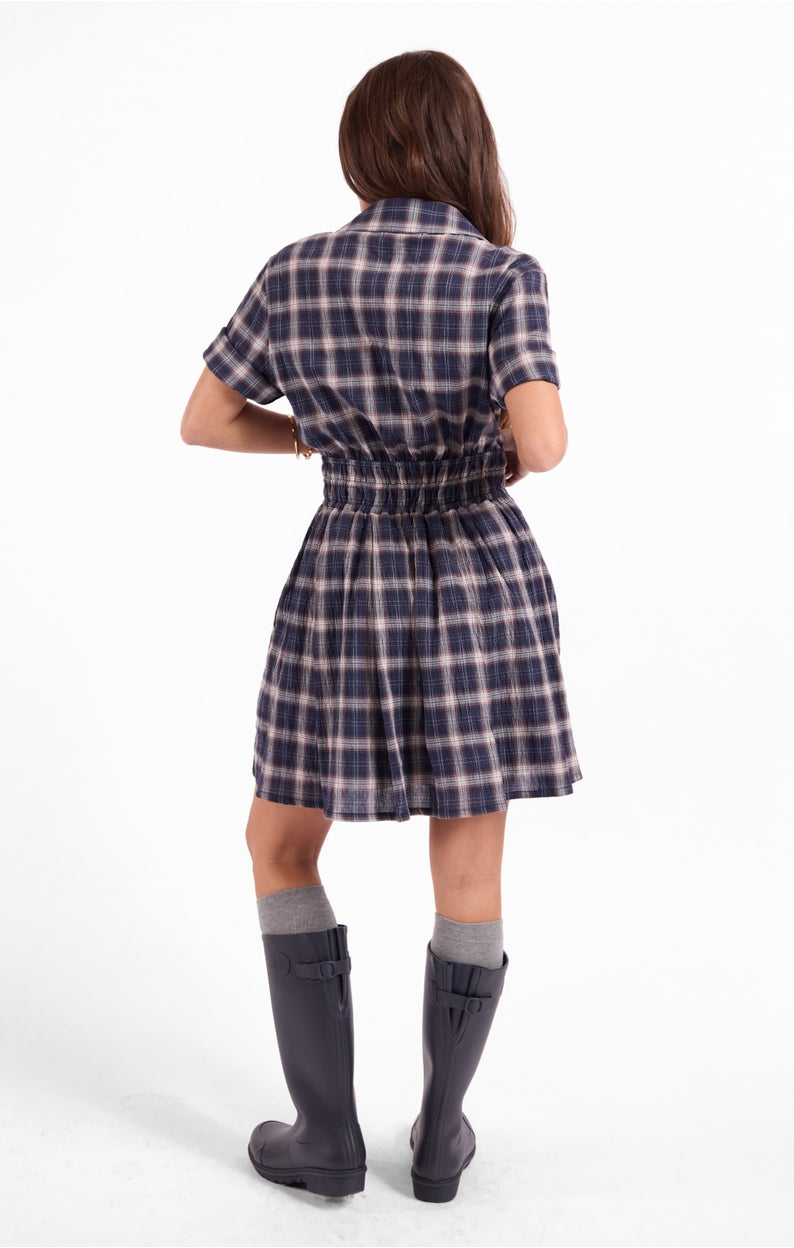 Navy plaid shirt dress with short sleeves and gathered waist, below-knee length