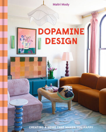 Colorful staged living room interior with sofa, armchair, coffee table, and wall art