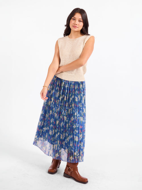 Oatmeal sleeveless sweater vest with crew neck and ribbed waist hem.