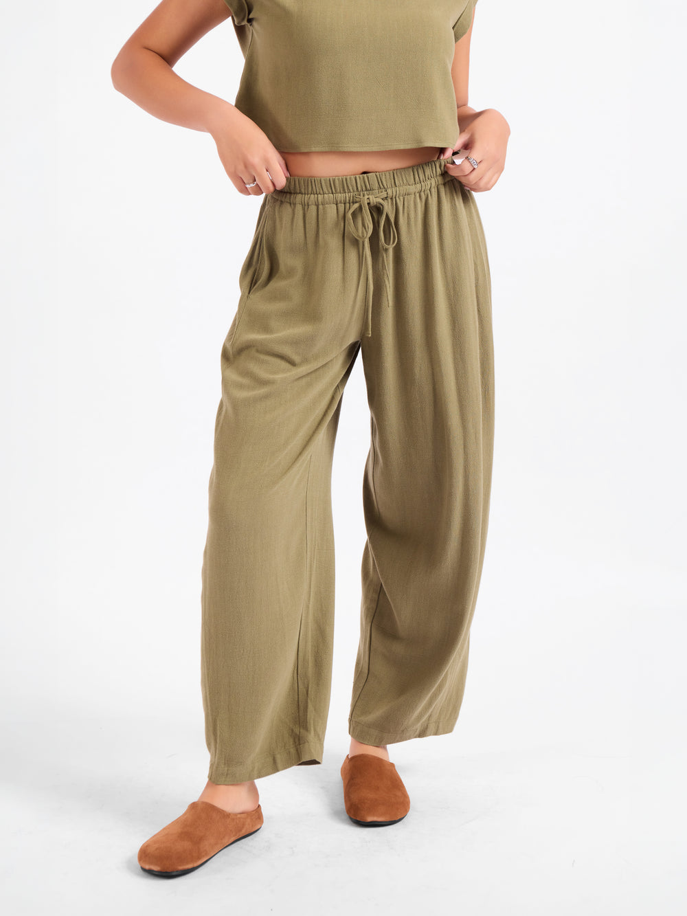 Olive green drawstring wide-leg pants with elastic waistband