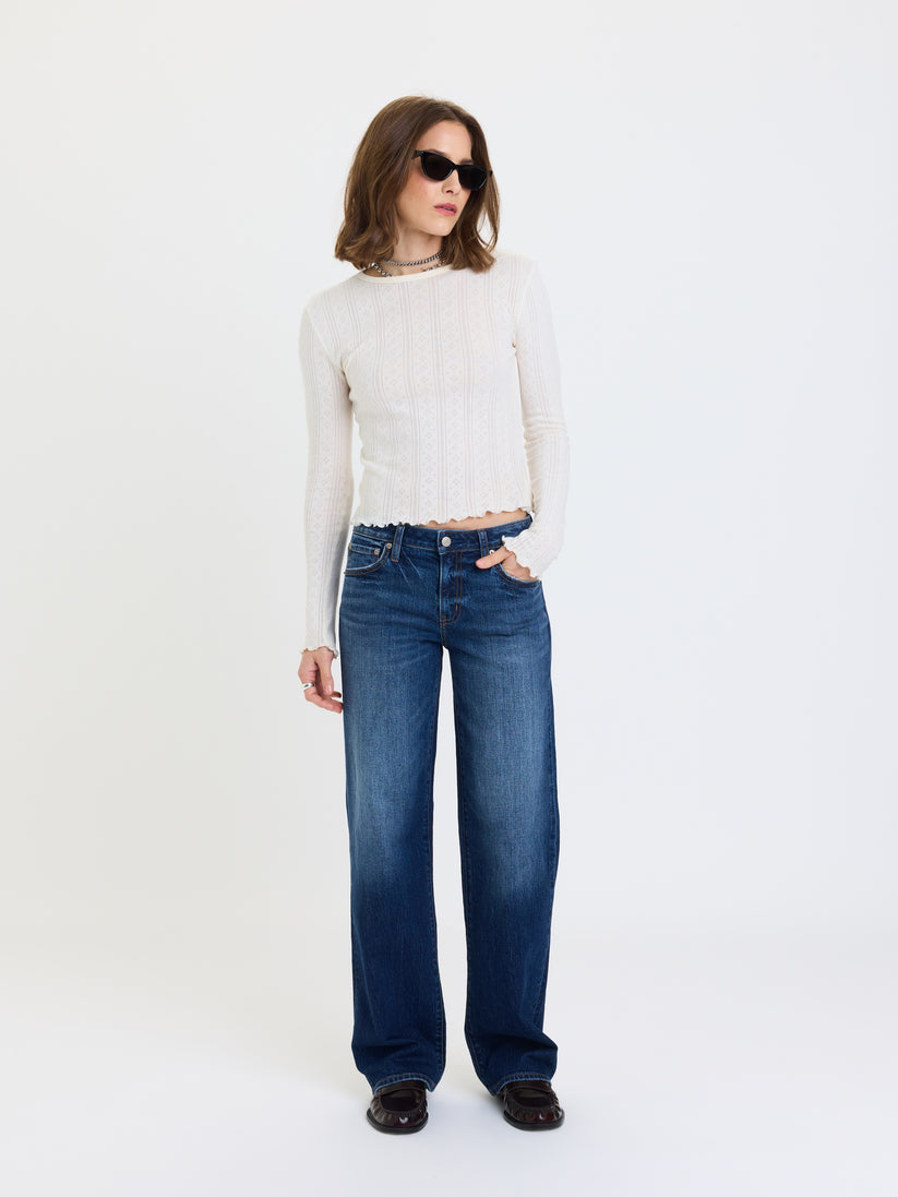 Low-rise straight jeans in dark blue denim, front view with belt loops and button fly