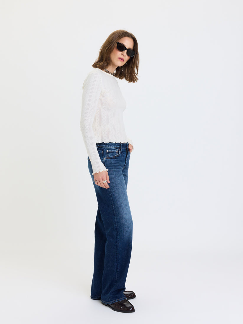 Low-rise straight jeans in dark blue denim, side view with straight legs and pockets