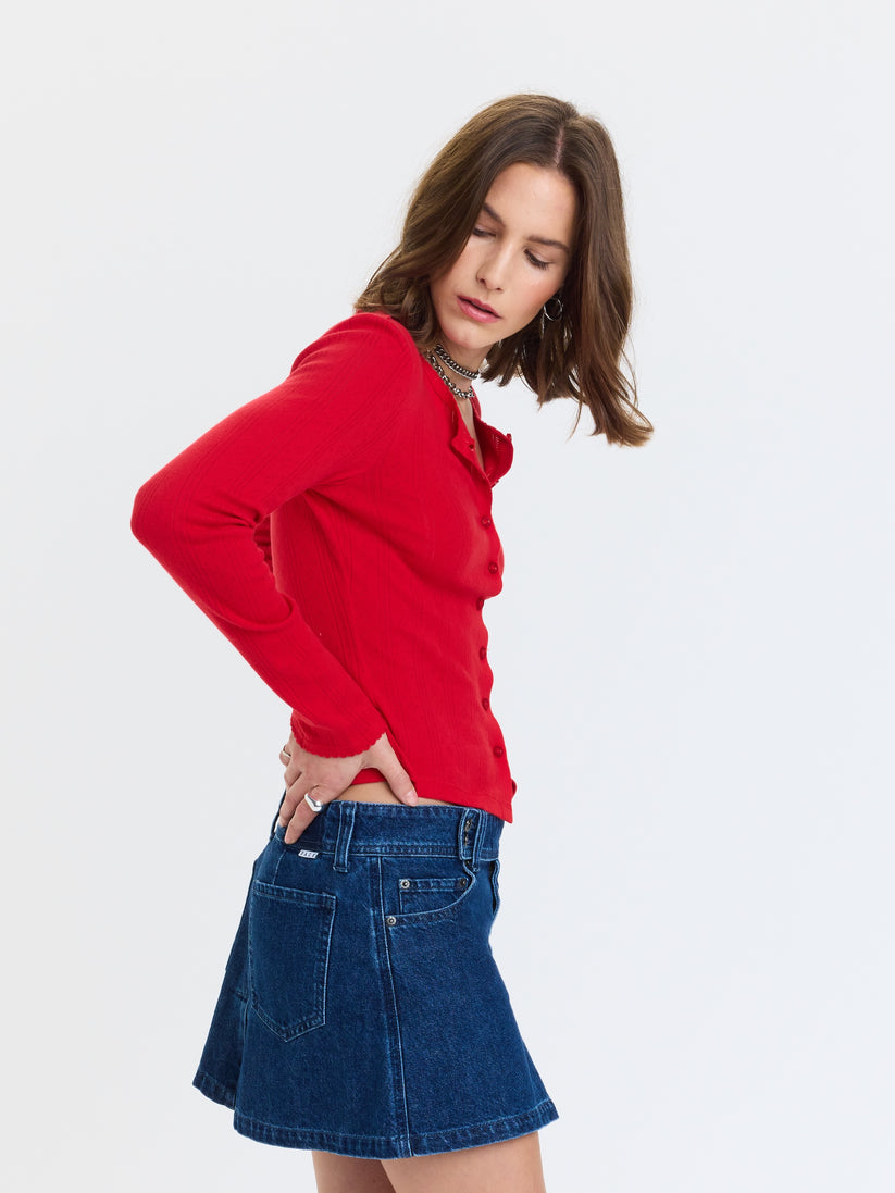 Stargazer pointelle cardigan in bright red, side view with button-front and long sleeves