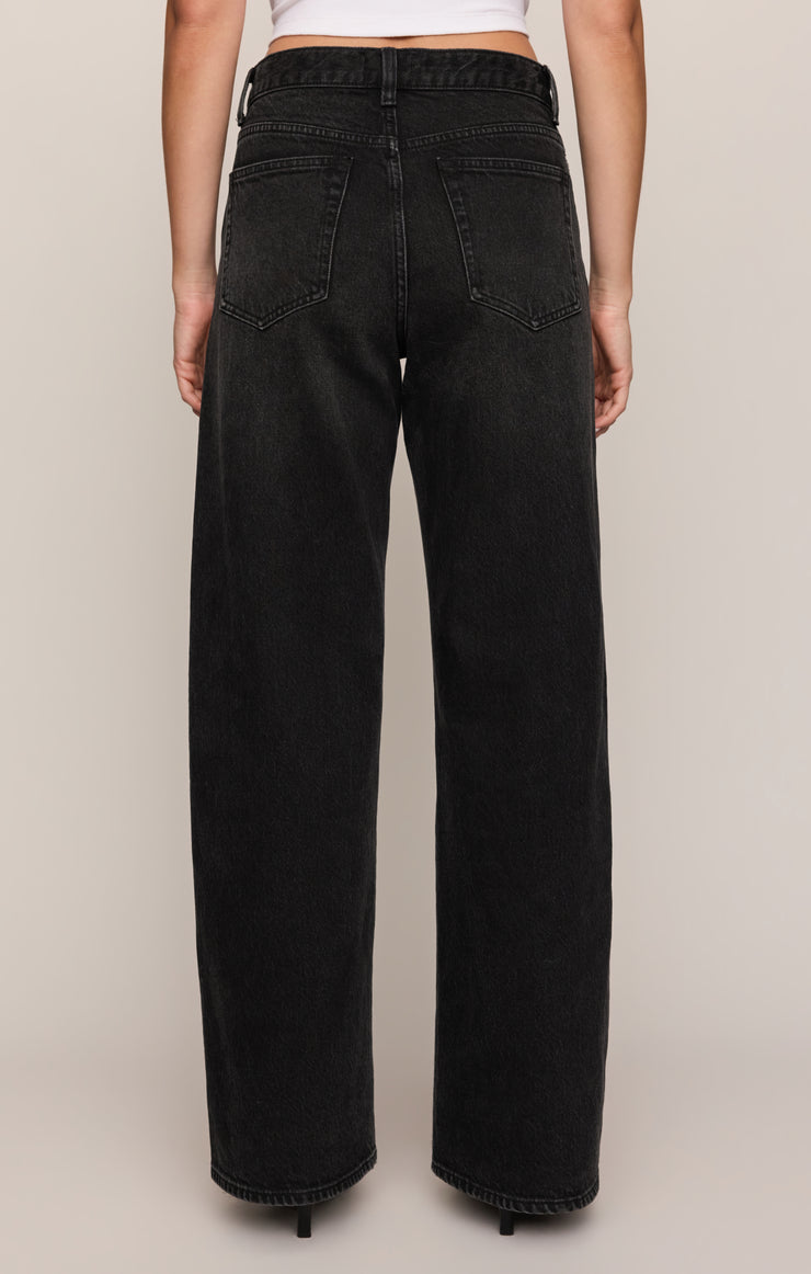 High-rise wide-leg dark jeans, back view with patch pockets and yoke