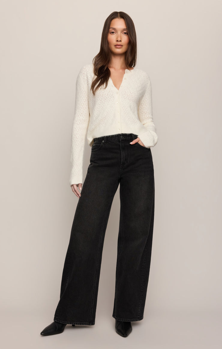 High-rise wide-leg dark jeans on model, wide leg and high waist