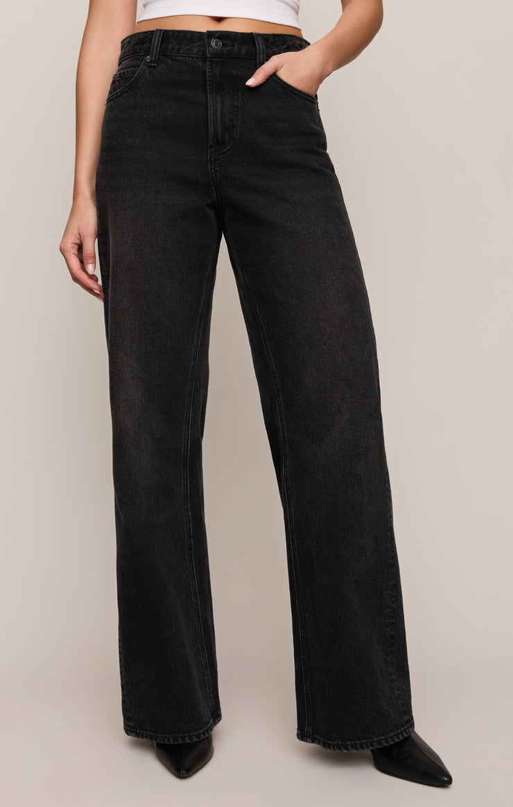 High-rise wide-leg dark jeans, front view with belt loops and fly