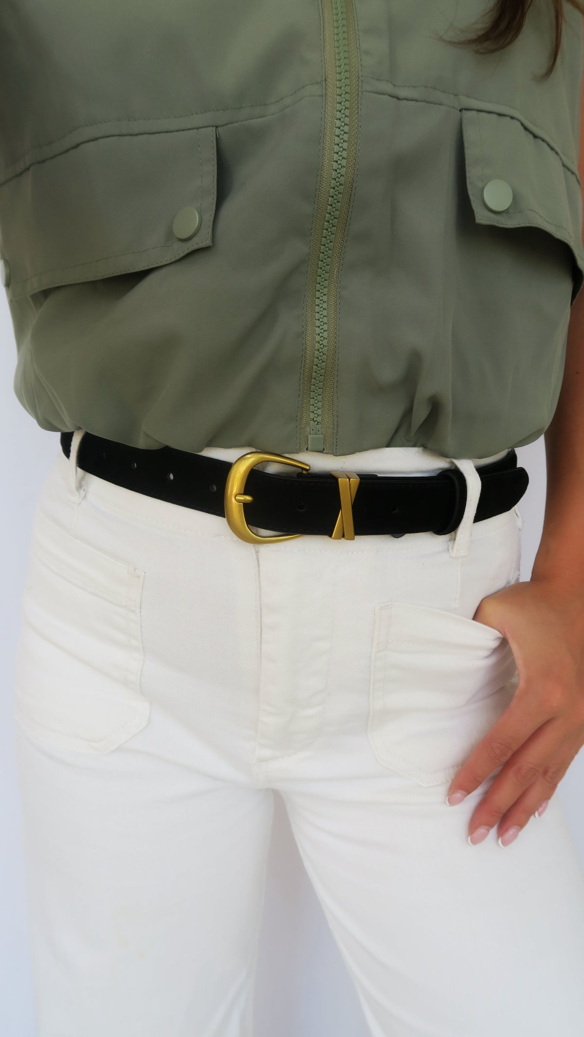 Black suede belt with gold-tone buckle and keeper on waistband