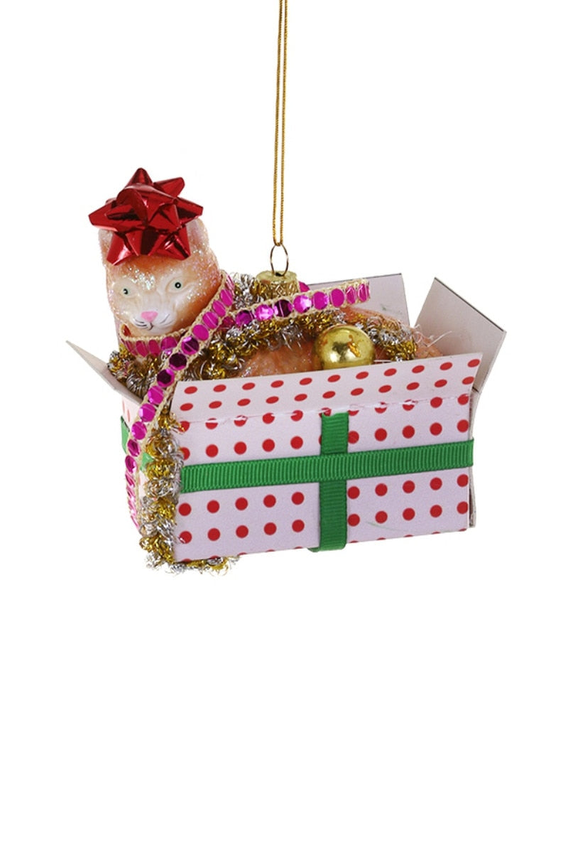 Hanging Christmas cat ornament peeking from a polka-dot gift box with ribbon bow