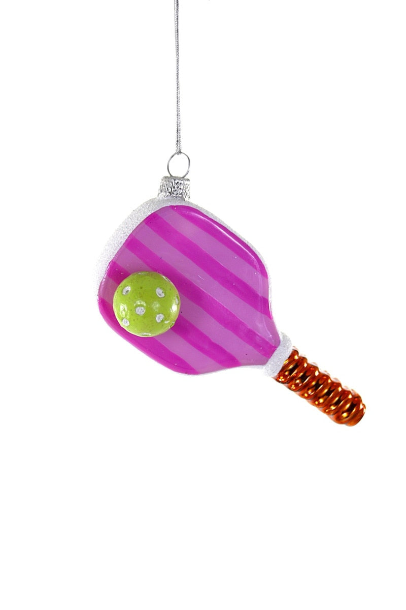 Pink striped pickleball ornament with green ball and orange handle, hanging loop at top