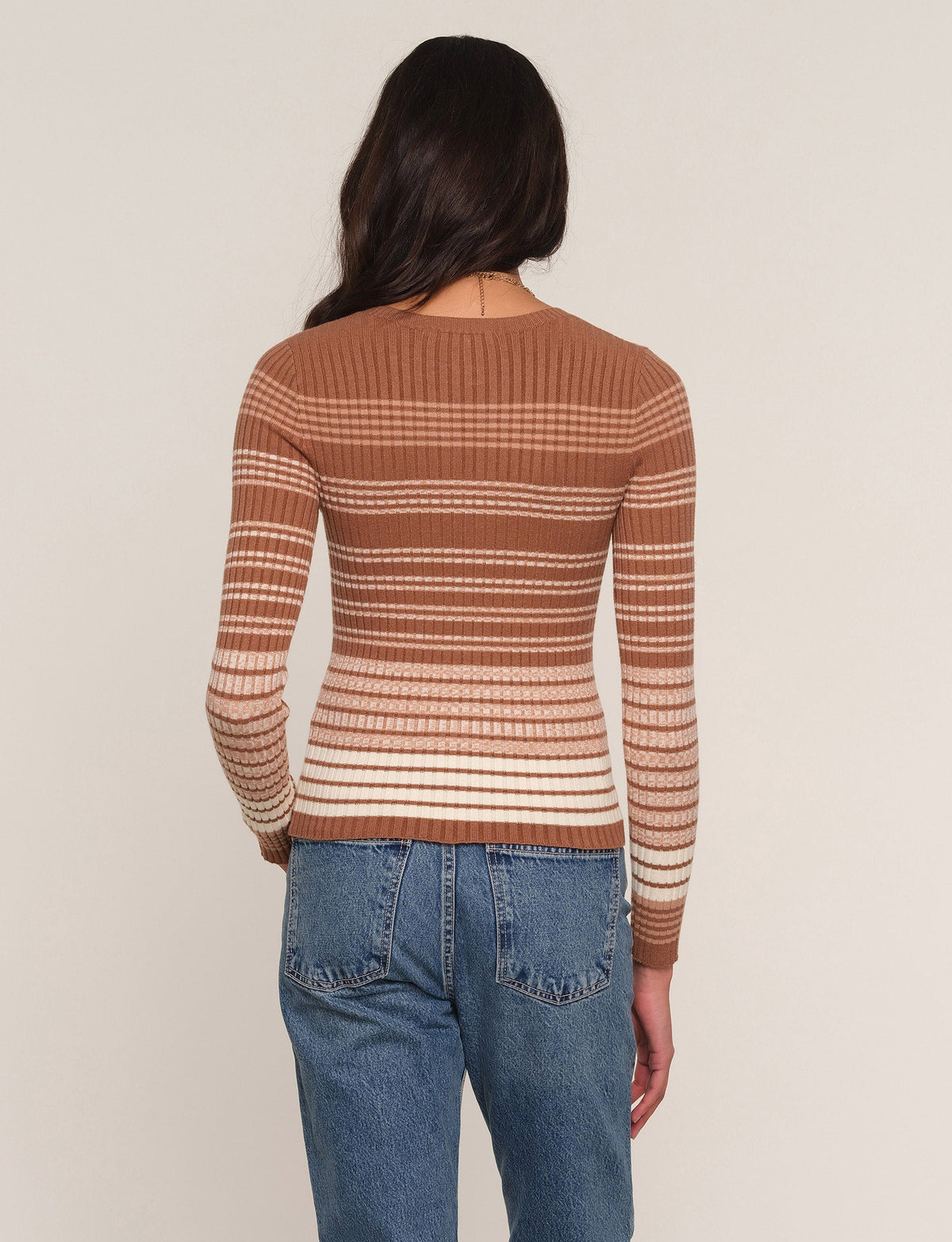 Striped knit long-sleeve top, rust brown and cream; back view
