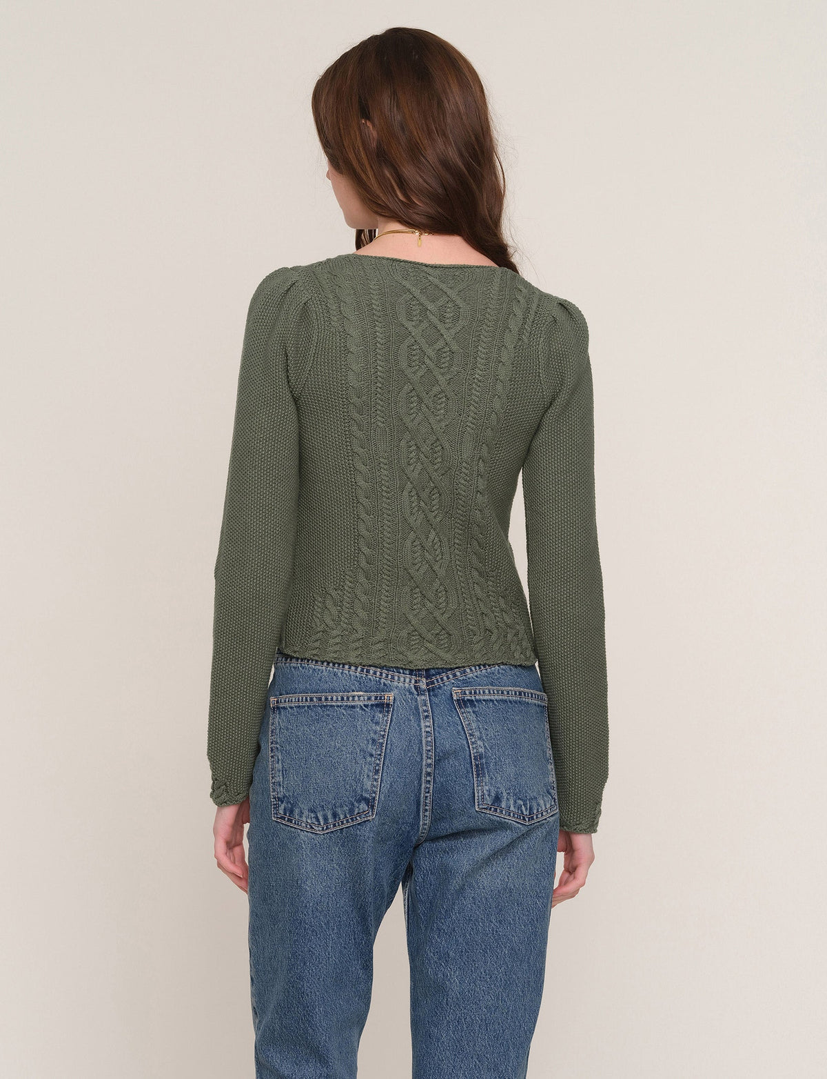 Zephyr green cable-knit sweater, back view with V-neck knit pattern