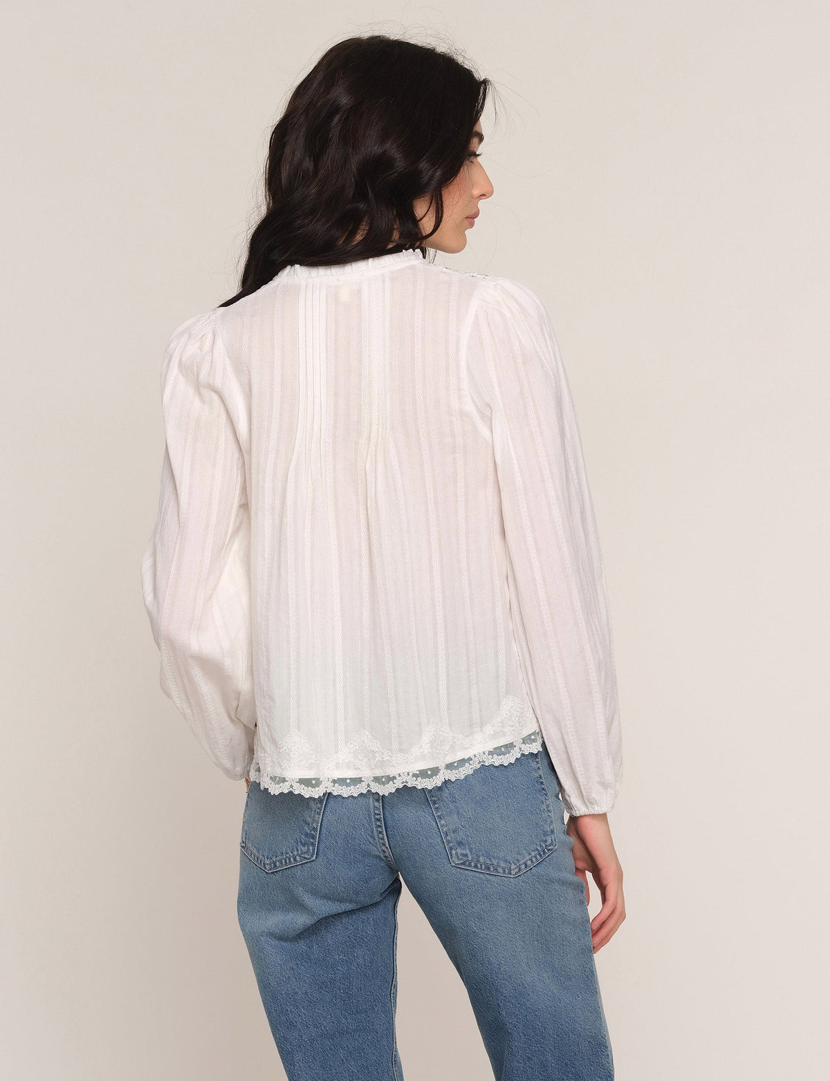 Ivory sheer blouse, back view with long sleeves and lace-trim yoke and hem