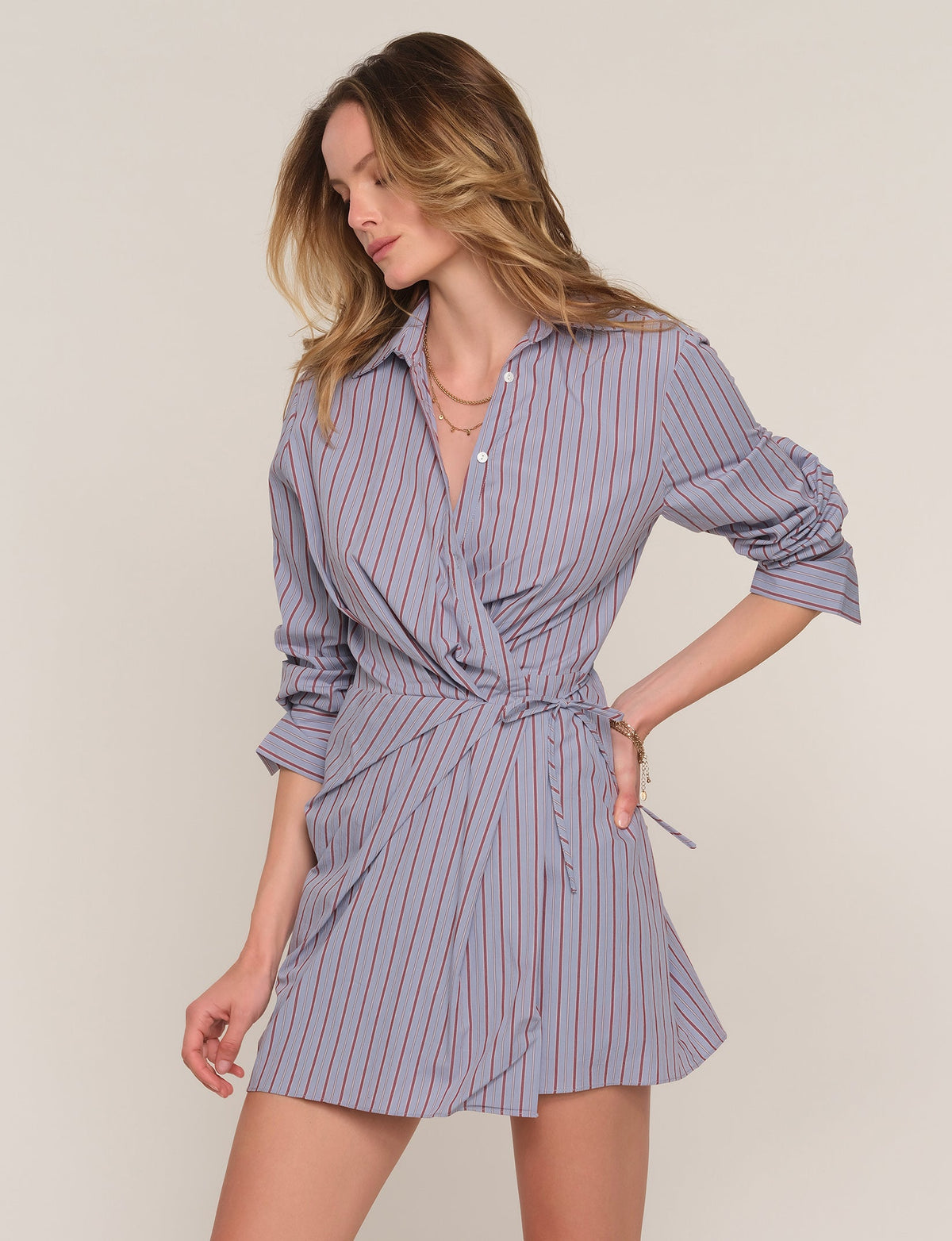 Shirt dress with button front, collar, and vertical blue-pink stripes, tied waist
