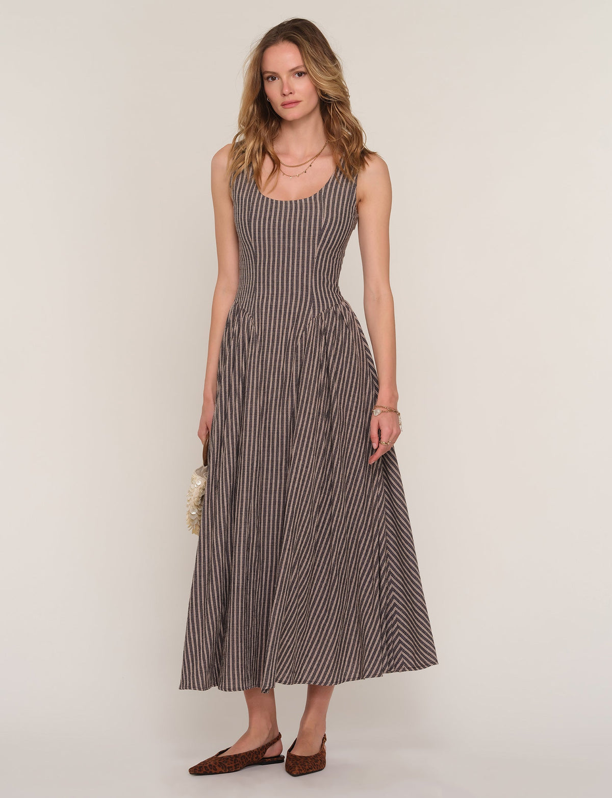 Sleeveless midi dress with vertical stripe print and gathered skirt