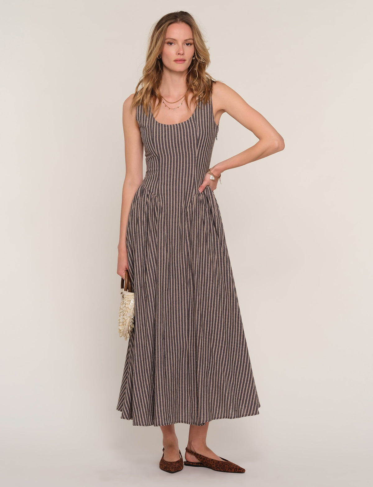 Sleeveless midi dress with vertical stripe print, fitted bodice and gathered skirt