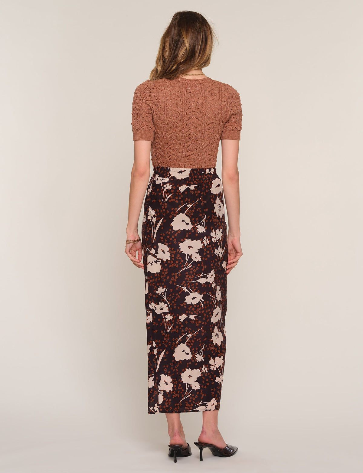 Zander skirt back view: dark floral maxi with side slit
