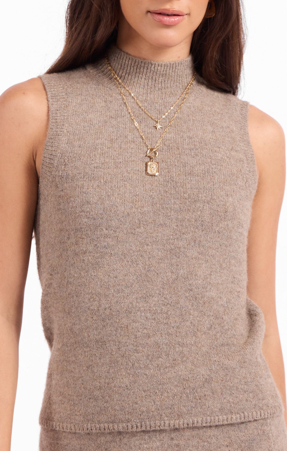 Heather beige knit sleeveless top with crew neck and ribbed hem detail