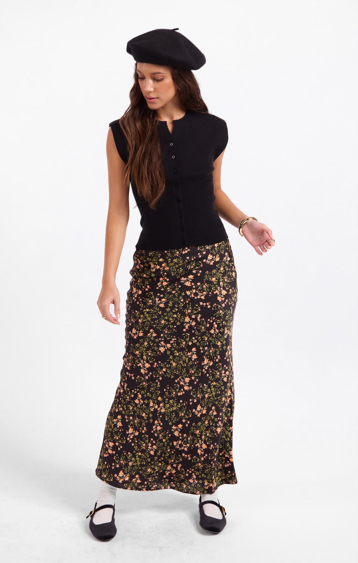 Floral midi skirt with fitted elastic waist, dark background and scattered flower print