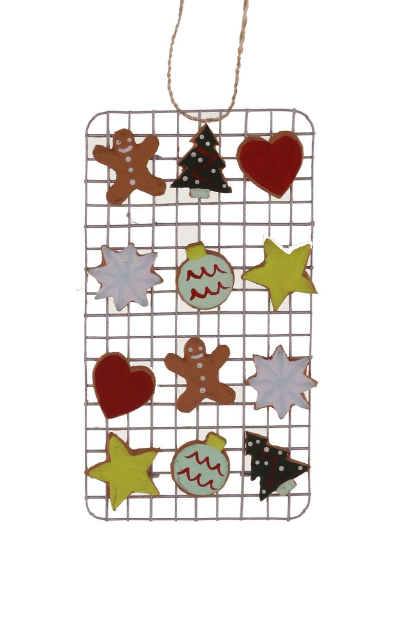 Decorated Christmas cookie ornament set on wire grid with gingerbread, hearts, stars