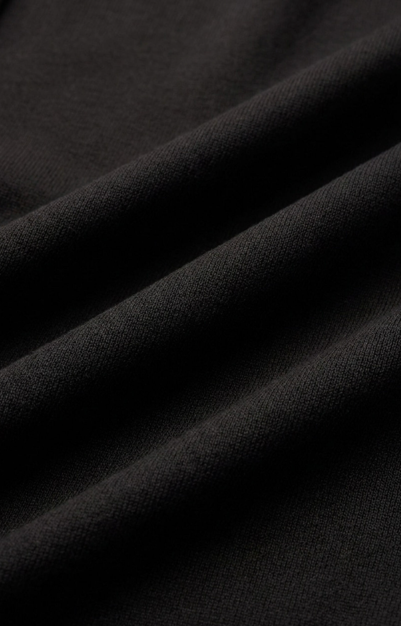 Black textured knit fabric with subtle weave