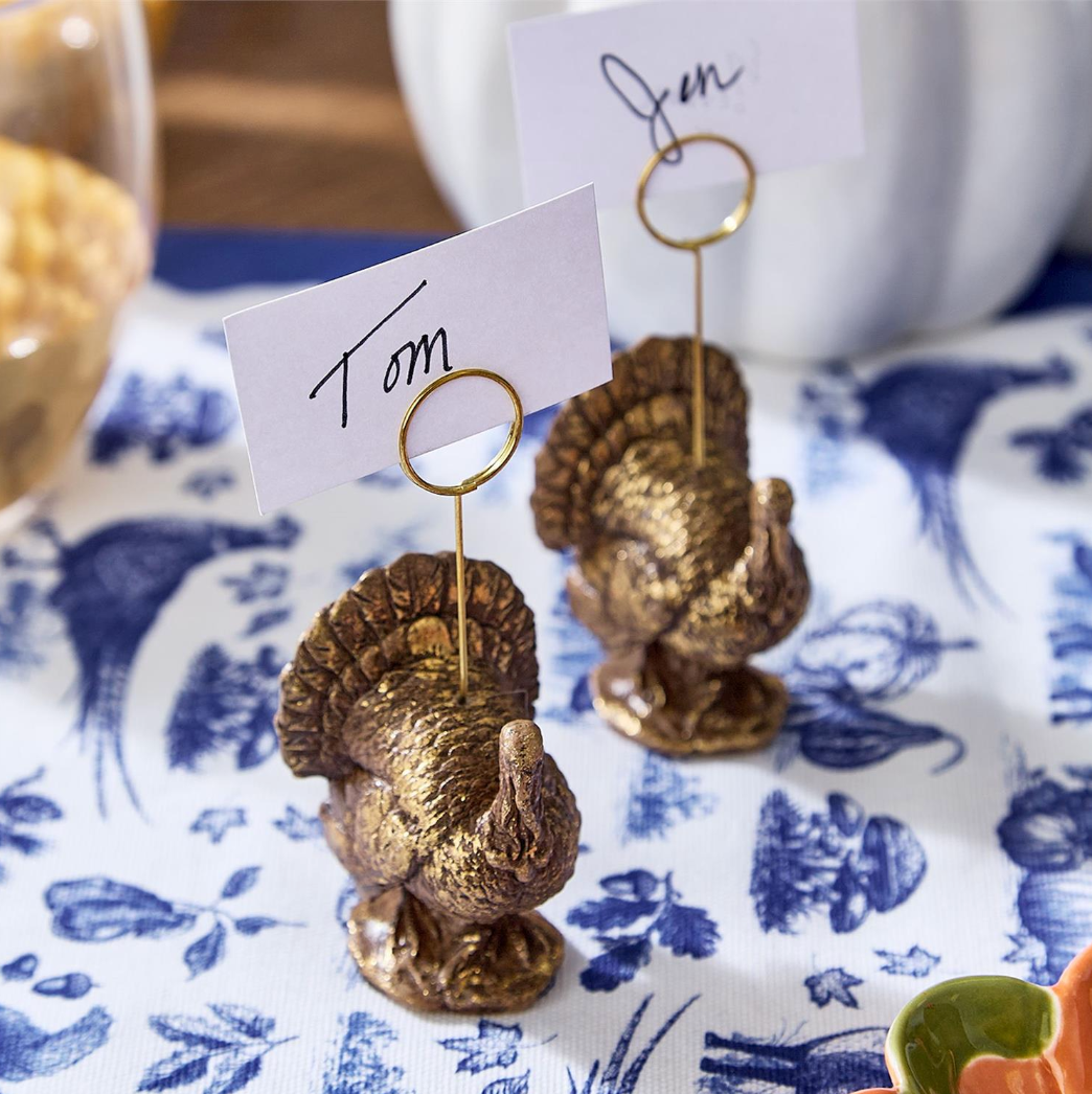 Golden turkey place card holder with round ring and 'Tom' name tag