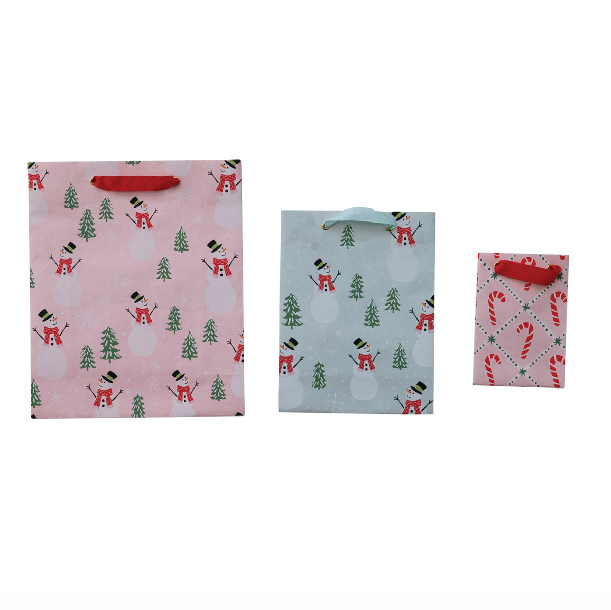 Festive gift bag set of three paper bags, pink, blue, and red with holiday figures